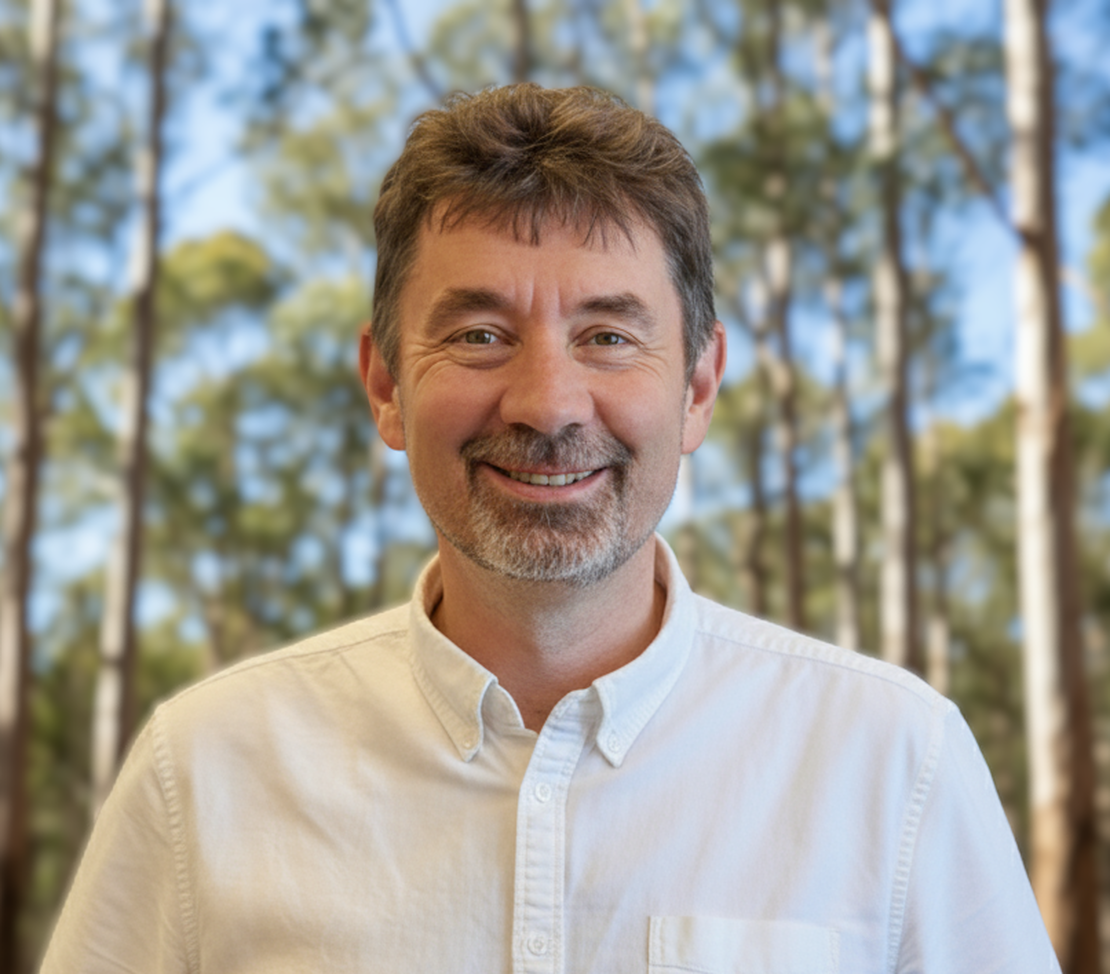A warm, professional headshot of Andrew, the co-founder of MindSpark and a mental health support guide for carers.